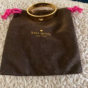 Kate Spade hole punch spade hinge bangle
With nice easy open clasp.